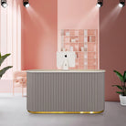 grey salon reception desk with gold and LED Light
