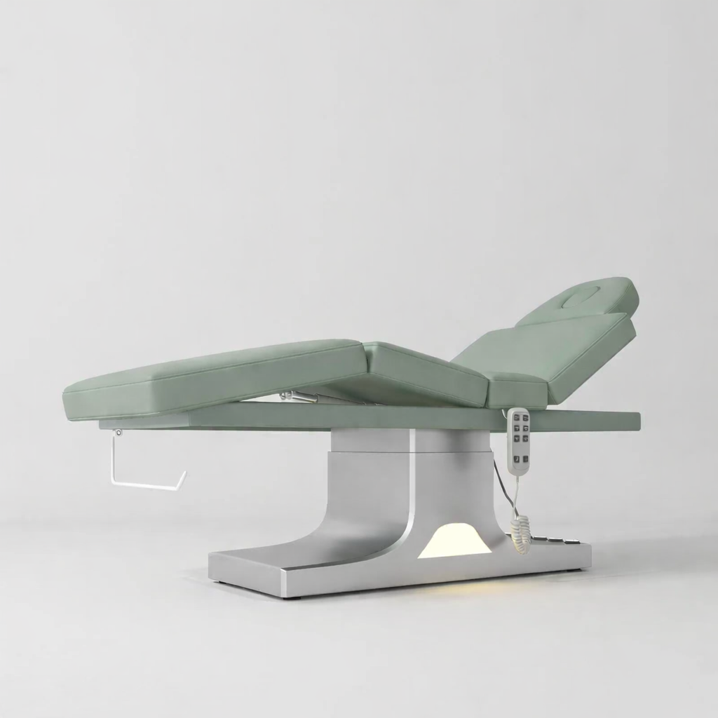 Electric bed for laying down treatments with foot control