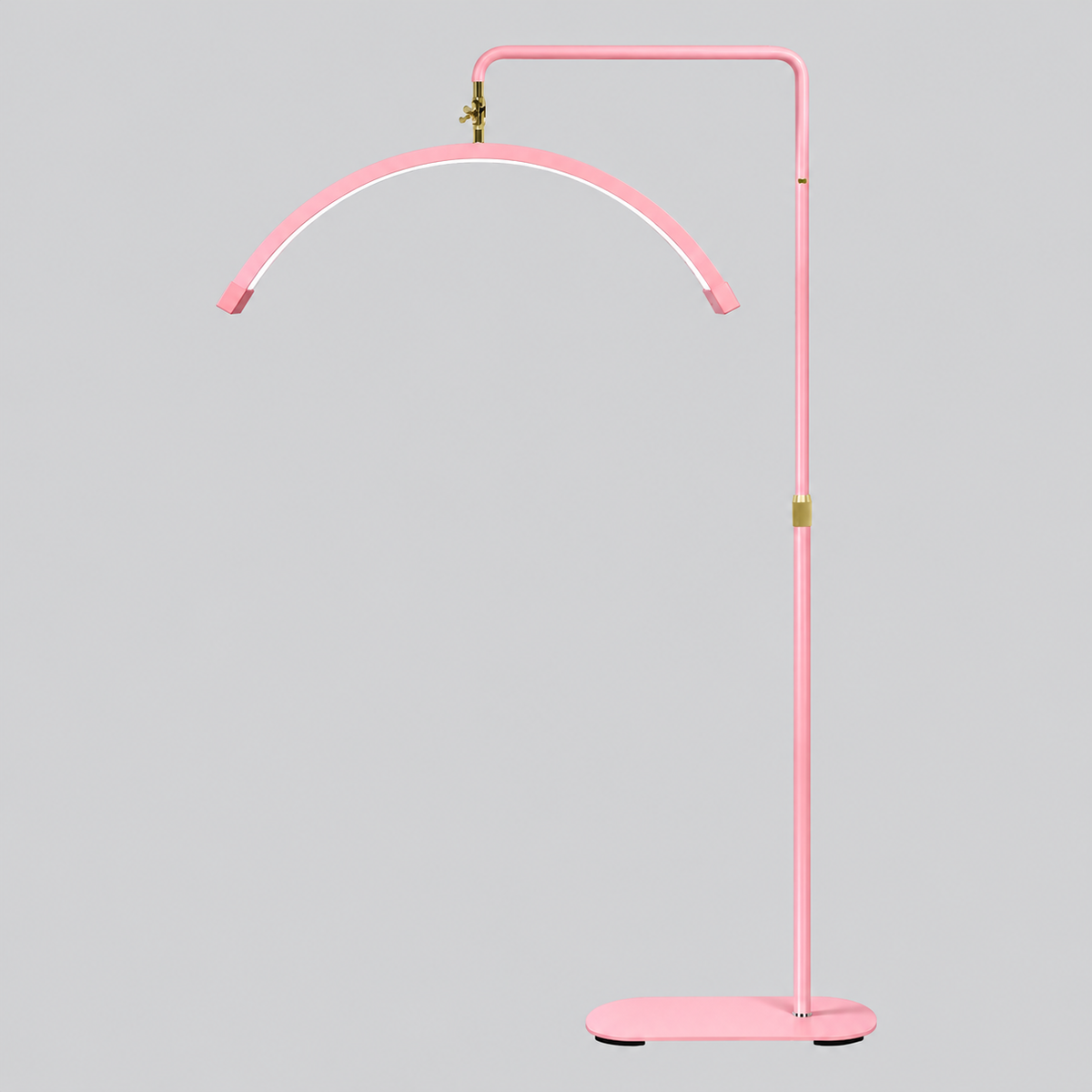 The Pink Moonlight shown in full, featuring a soft pink frame with luxury gold detailing, adjustable height and arch design.