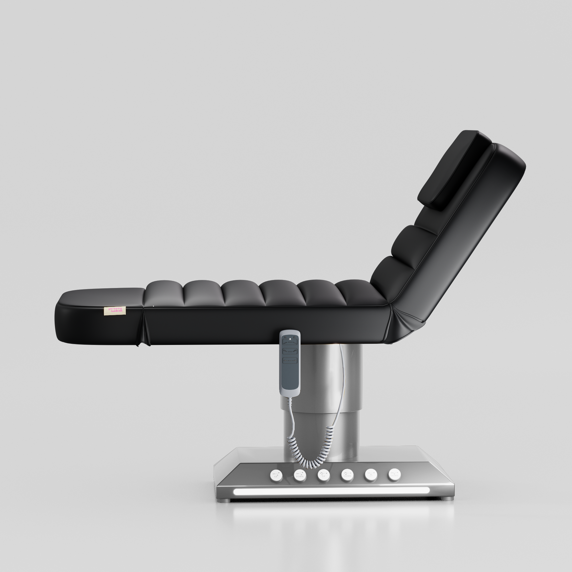 Black adjustable beauty bed with silver base and integrated foot control system