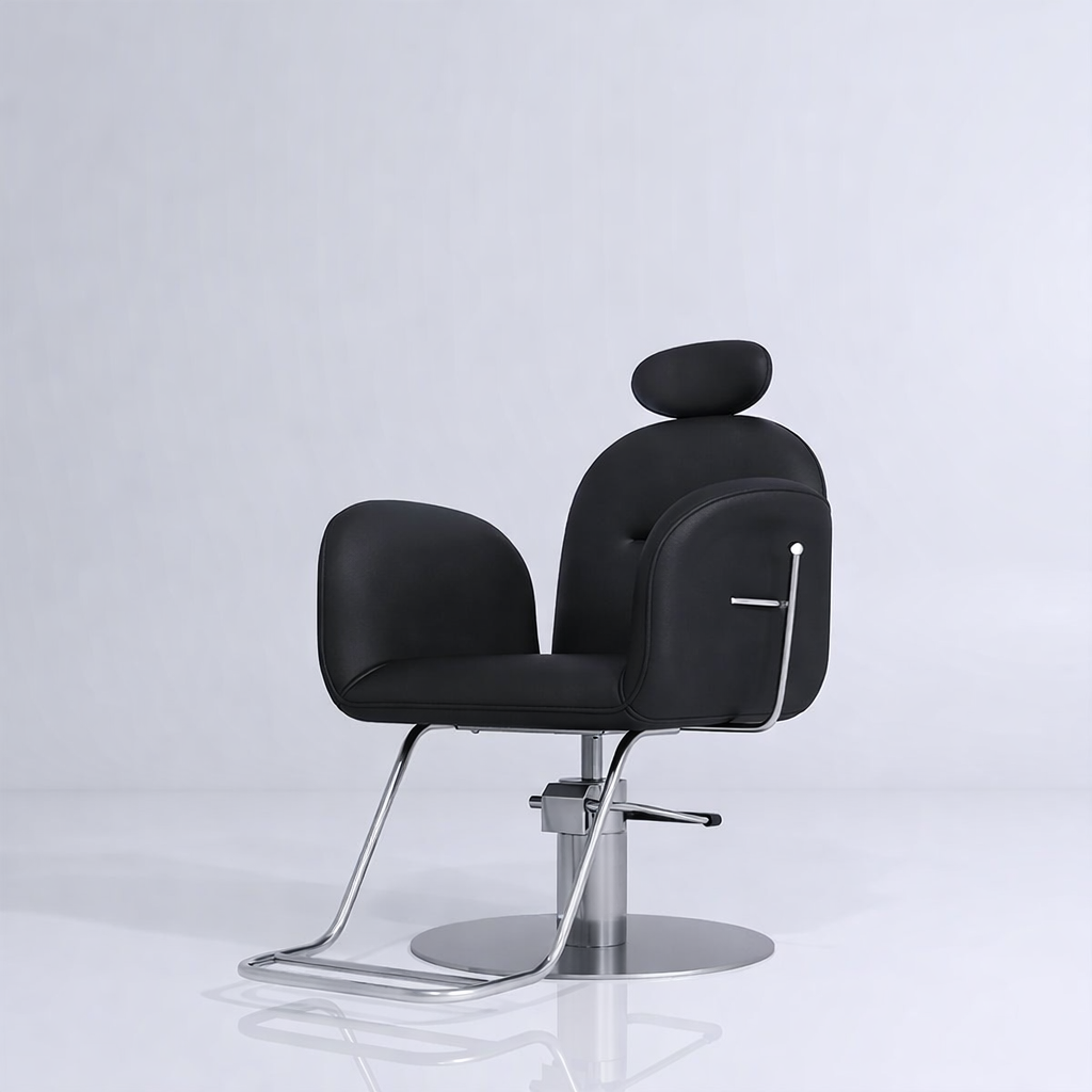 Black leather styling chair with silver footrest that reclines