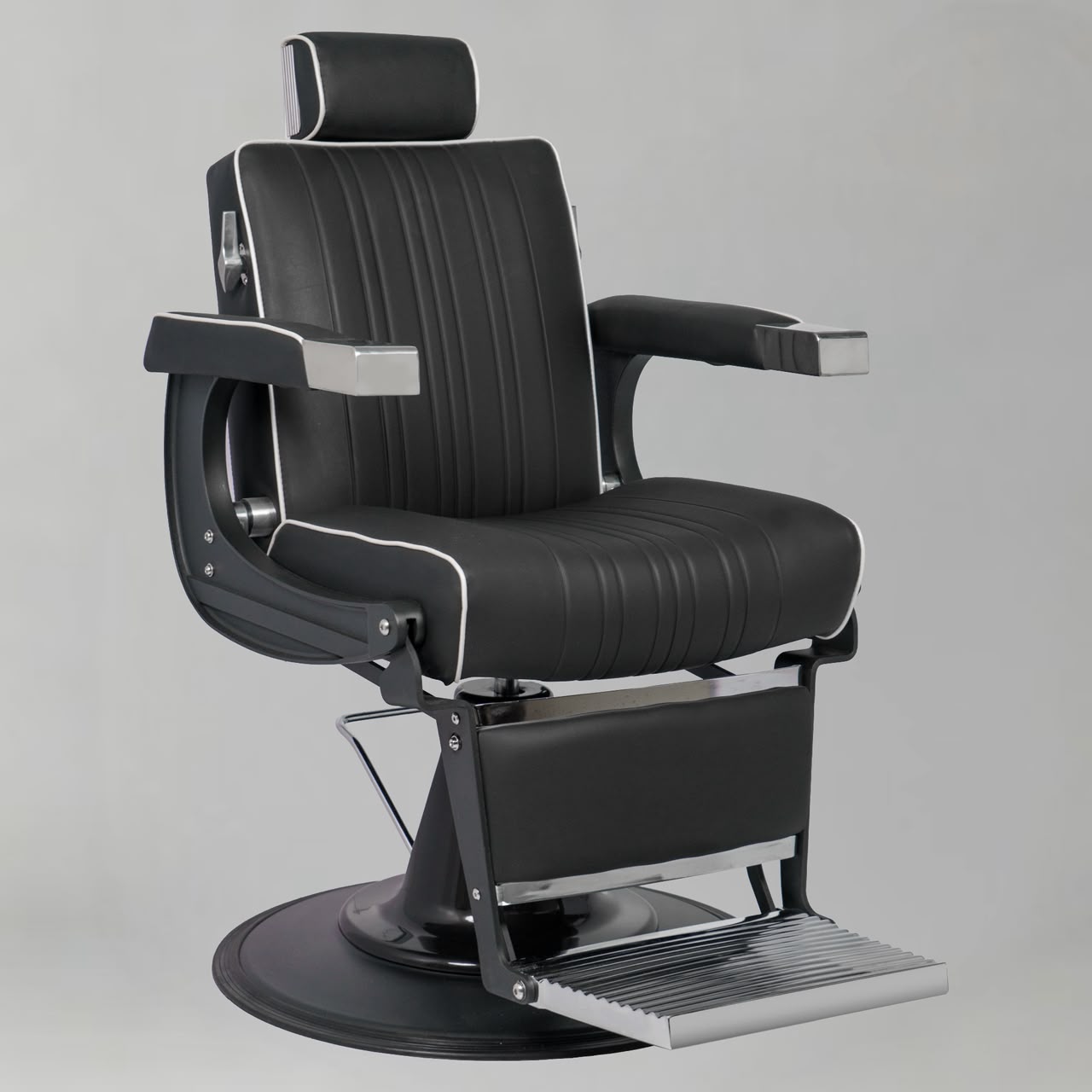 Modern barber chair with whiye piping black base and silver foot rest