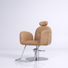 Light brown chair with silver footrest and foot pump