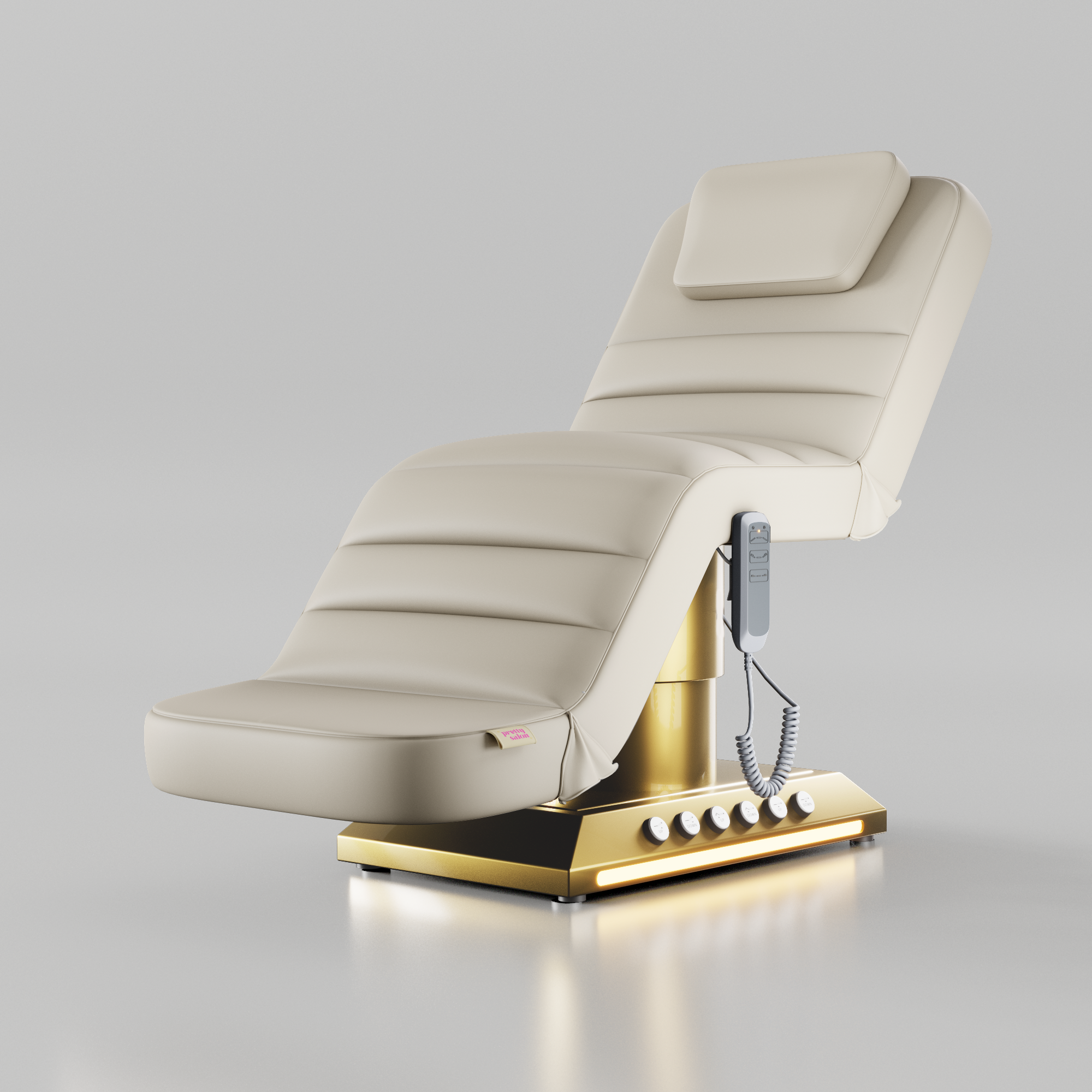 Cream electric treatment bed with gold base and foot control for beauty treatments