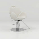 Cream leather chair used for eyebrow treatments that reclines