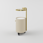 Elegant nude and gold trolley topped with durable sintered stone.