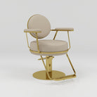 nude and gold hair chair with foot pump and rest 
