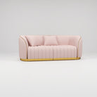 pink leather sofa with gold trim 