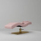 Pink leather beauty bed with gold rectangle base with pump