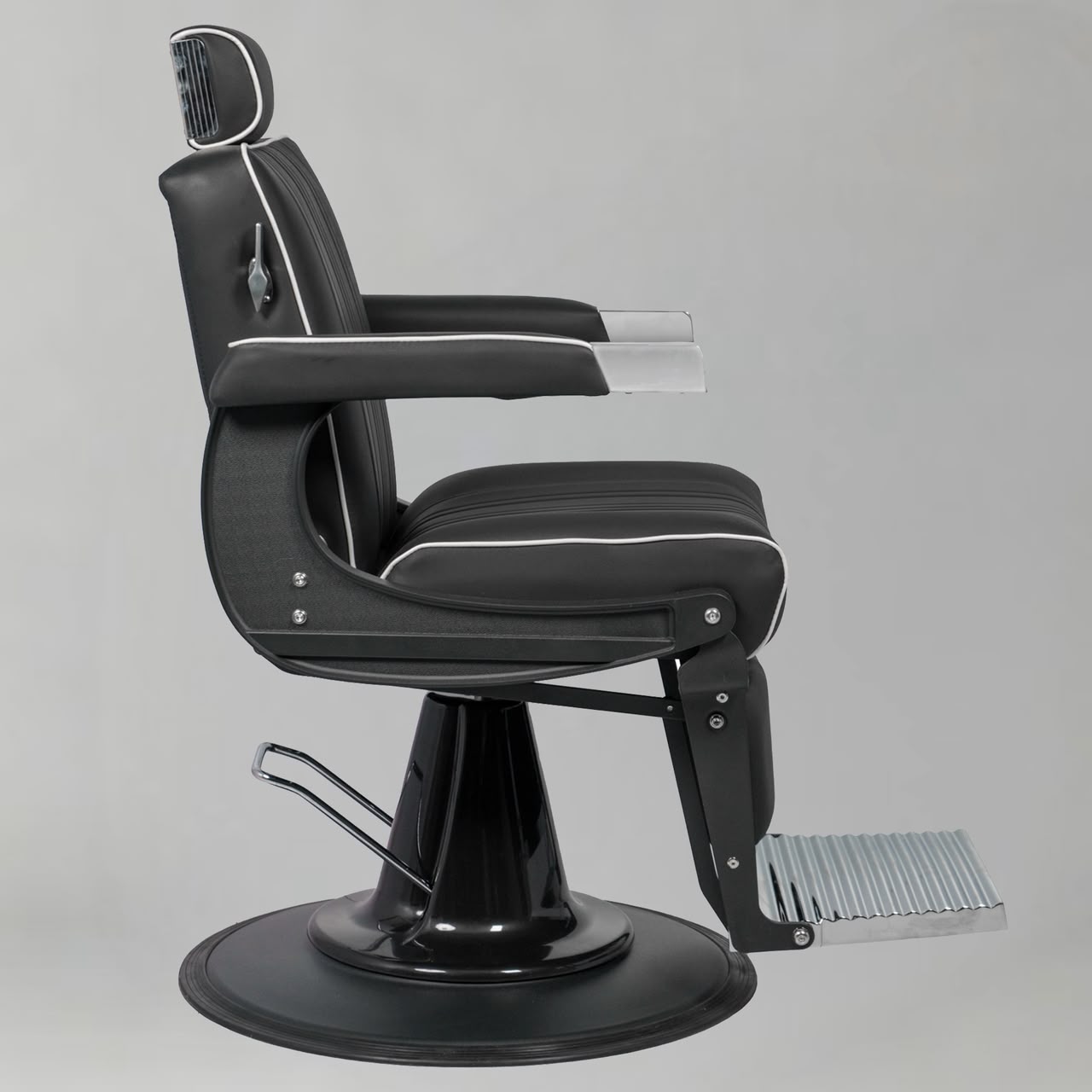 Black barber chair with white accents 