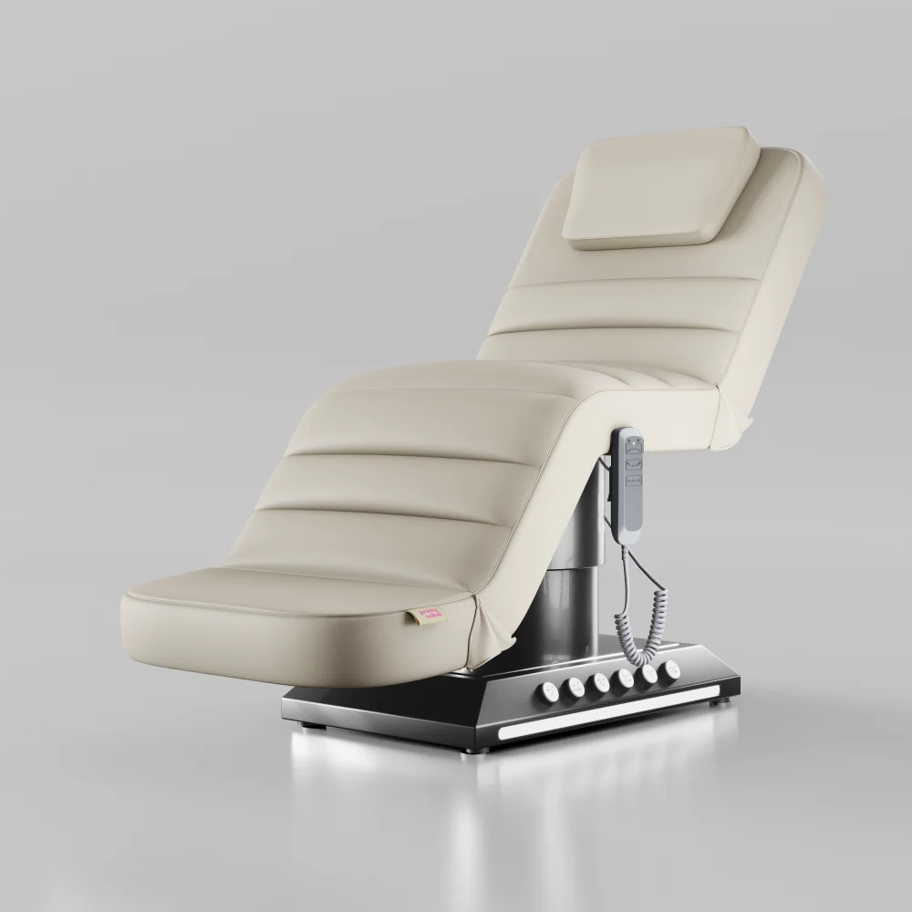 Cream electric treatment bed with chrome black base and foot control for beauty treatments
