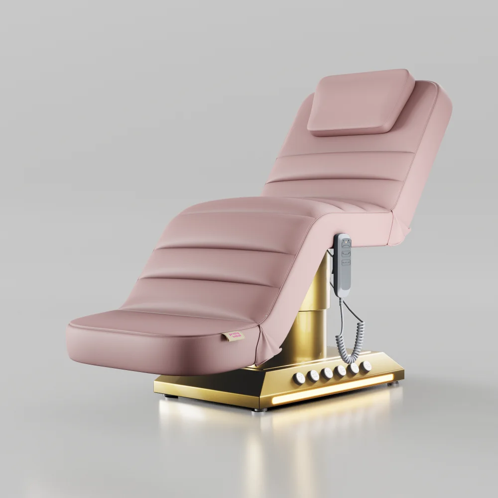 Pink electric treatment bed with foot control and gold base for beauty and aesthetic treatments