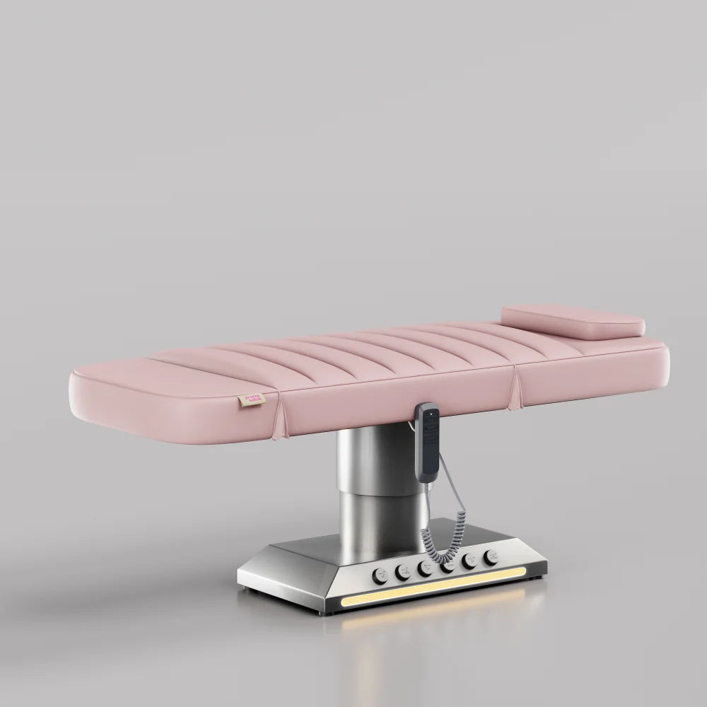 Pink electric treatment bed with foot control and silver base for beauty and aesthetic treatments
